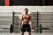 © Guille Faingold/Stocksy - Man lifts weights In a gym