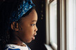 © Gabriel (Gabi) Bucataru/Stocksy - African American girl's profile looking out the window