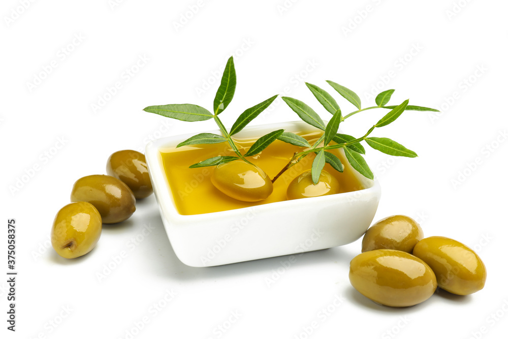 Bowl of olive oil on white background