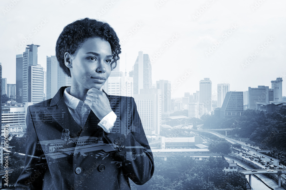 Attractive black African American business woman in suit with hand on ...