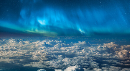 amazing aurora borealis above the clouds