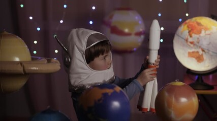 Wall Mural - Space Travel Game Inspiration Spaceship. Little Kid Boy Astronaut Launching Toy Rocket From Spaceport Through Planets. Child Dreamer Playing With Toy Space Rocket Flying Among Planets. SLOW MOTION.