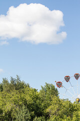 Wall Mural - Ferris wheel against the blue sky.