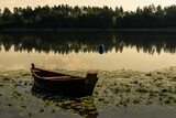 Fototapeta Na ścianę - a boat on the lake in Masuria in Poland after sunset