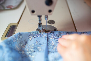 a picture of using a sewing machine for making dress