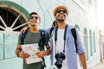 Wall Mural - Two happy male tourists talking and having fun on the trip. Travel and love concept in Latin America