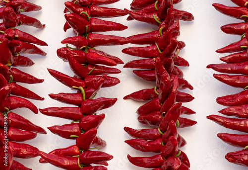 Fotomural Ezpeleta, red hot peppers drying on basque house wall