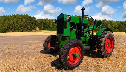 Poster - Retro tractor on the field near the farm