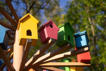 Bird houses. Colored birdhouses on the street.