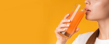 Unrecognizable Woman Drinking Orange Or Carrot Fresh Vitamin Juice