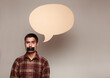 © Brian Powell/Stocksy - man with empty speech bubble