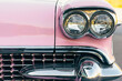 © Deirdre Malfatto/Stocksy - close up of antique pink and chrome car