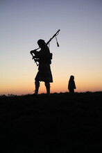 Silhouette Of A Bagpipe Player At Sunset