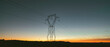 © JAVIER PARDINA/Stocksy - landscape with electric tower at sunset.