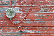 Meter On Weathered Red Wall