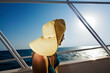 © Ilya/Stocksy - Woman on ship