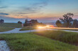 Zakopianka road with car light trail in Chabowka at susnet time.
