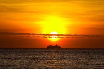 Boat at sunset over the sea.