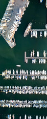 Wall Mural - Overhead aerial view of small boats docked in the port, panoramic drone viewpoint