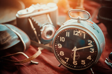 Wall Mural - Retro alarm clock and manual camera on the countertop in sunday flea market. Shopping at antique bazaar.