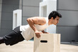 © Atstock Productions - Handsome Indian sports man doing push up exercise outdoors on building rooftop, home workout in the open air concept