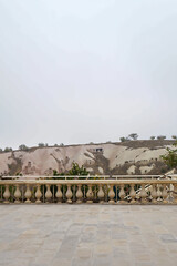 Wall Mural - Fence with landscape of Cappadocia, semi-arid region in central Turkey known for distinctive fairy chimneys, tall cone-shaped rock formations clustered in Monks Valley, Göreme and elsewhere- Kayseri