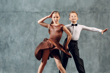 Young dancers boy and girl dancing in ballroom dance Samba