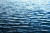 Fototapeta  - Waving surface of water on the lake as a background.