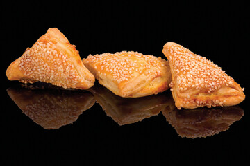 Tasty baked cheese sandwiches, isolated on black background