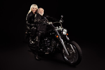 Sticker - Portrait of his he her she nice attractive cool free content cheerful cheery trendy grey-haired rockers driving chopper world travelers hobby isolated over black color background