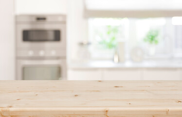 Wall Mural - empty wood table top and modern blurred kitchen window background