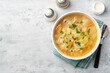 Homemade cabbage soup in bowl on concrete background
