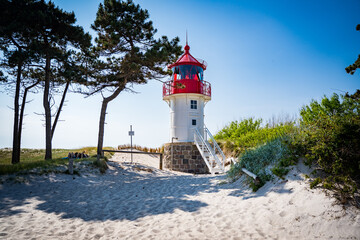 Canvas Print - red white lighthouse on the coast