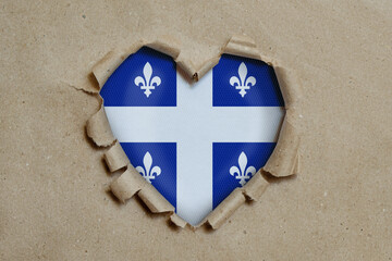 Wall Mural - Heart shaped hole torn through paper, showing Quebec flag