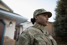 Portrait Of Army Soldier Standing In Driveway