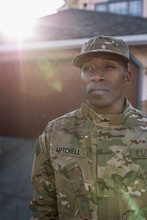 Portrait Of Army Soldier Standing In Driveway