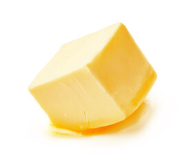 A piece of melting butter isolated on white background. Butter cube.