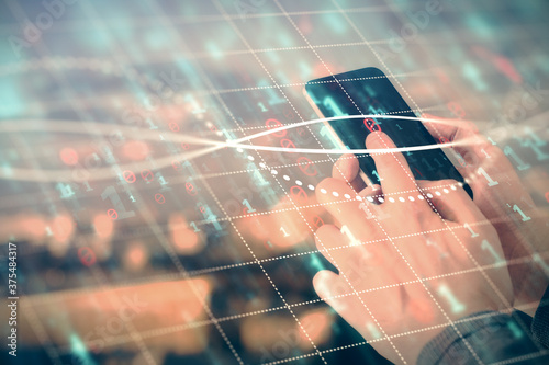 Cuadros en Lienzo Double exposure of man's hands holding and using a digital device and forex graph drawing