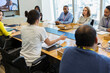 © Martin Barraud/Caia Image - Business people talking in conference room meeting