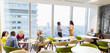 © Martin Barraud/Caia Image - Business people talking and drinking coffee in highrise cafeteria