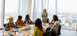 © Martin Barraud/Caia Image - Businesswoman leading conference room meeting in highrise office