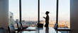 © Martin Barraud/Caia Image - Businesswoman preparing for meeting in highrise conference room