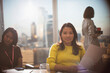 © Tom Merton/Caia Image - Portrait confident businesswoman with paperwork in conference room meeting
