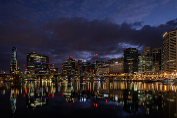 Wall Mural - Dawn clouds and cityscape