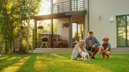 Wall Mural - Smiling Father, Mother and Son Pet and Play with Smooth Fox Terrier Retriever Dog. Sun Shines on Idyllic Happy Family with Loyal Pedigree Dog have Fun at the Idyllic Suburban House Backyard