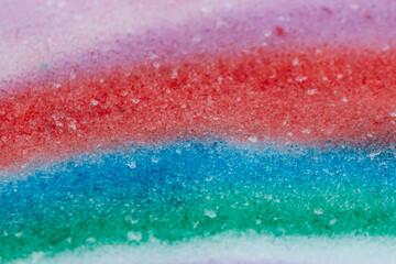  multi-colored paints in the snow as a background