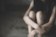 © Tinnakorn - Blurred image of Young  women sitting in dark room feeling pain with life problem.   Stop violence against and sexual abuse women, domestic violence, human trafficking.