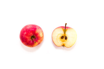 Wall Mural - Half a sliced fresh small red Apple on a white background