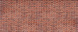 Panoramic background of wide old red and brown brick wall texture. Home or office design backdrop.