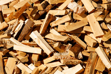 Poster - chopped firewood lie in a heap. horizontal cropping